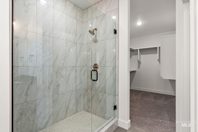 1724 Black Elm, Star, ID 83669 - bathroom featuring baseboards, a spacious closet, and a stall shower