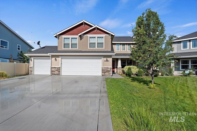 craftsman-style house featuring a garage and a front yard