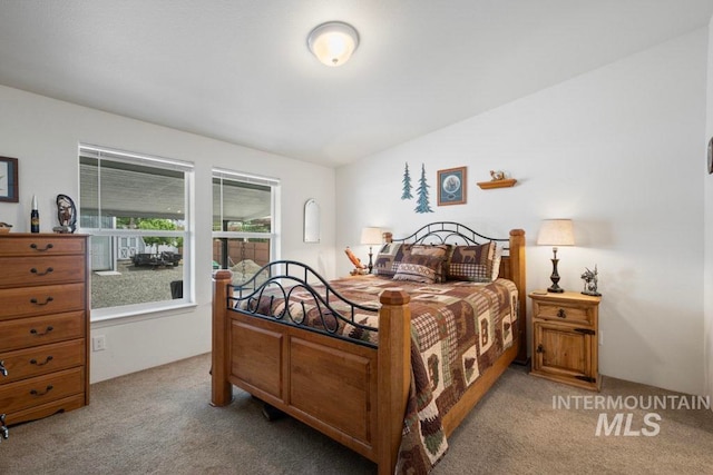 bedroom with light colored carpet