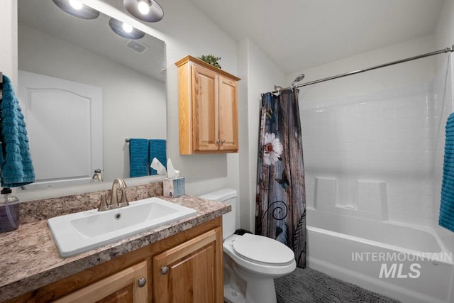 bathroom featuring toilet, vanity, and shower / tub combo with curtain