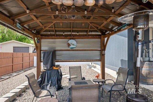 view of patio / terrace featuring fence and a gazebo
