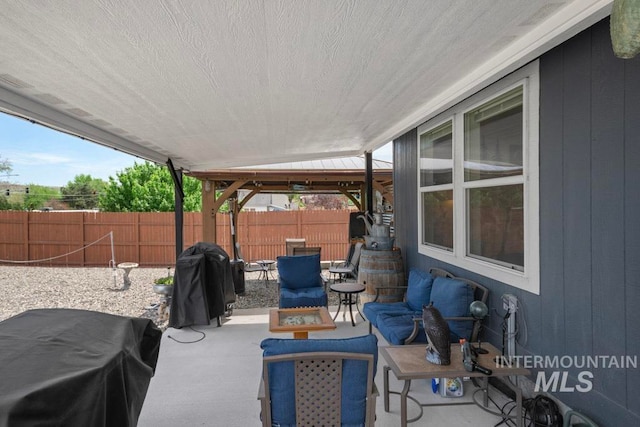 view of patio featuring outdoor dining space and a grill