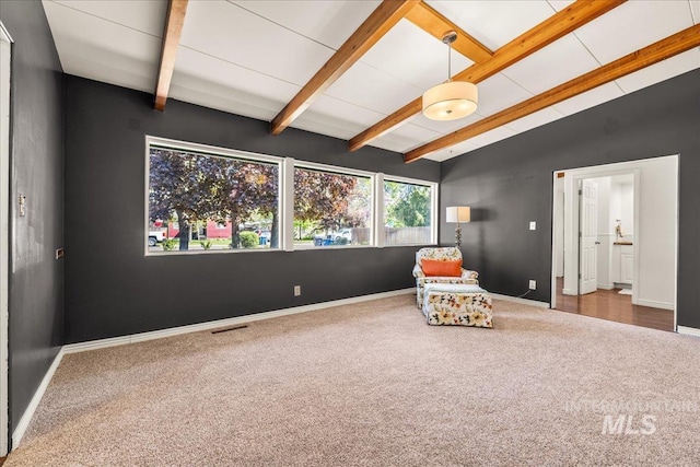 living area with visible vents, carpet flooring, baseboards, and lofted ceiling with beams