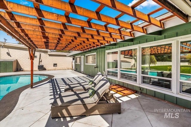 view of patio / terrace featuring a pergola and an outdoor pool