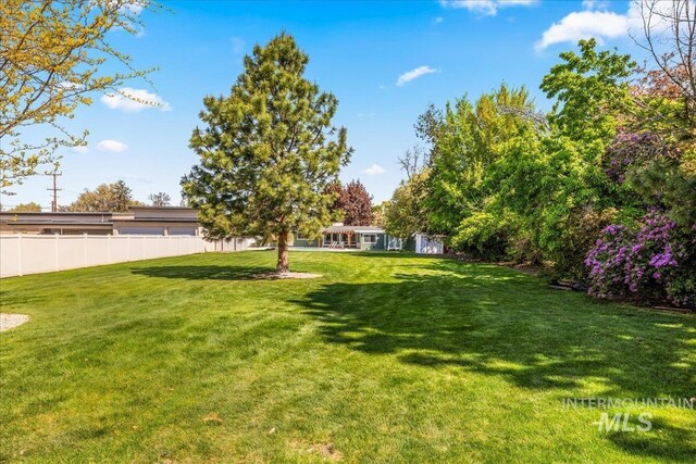 view of yard with fence