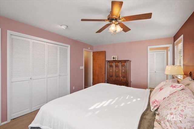 bedroom with ceiling fan and light colored carpet