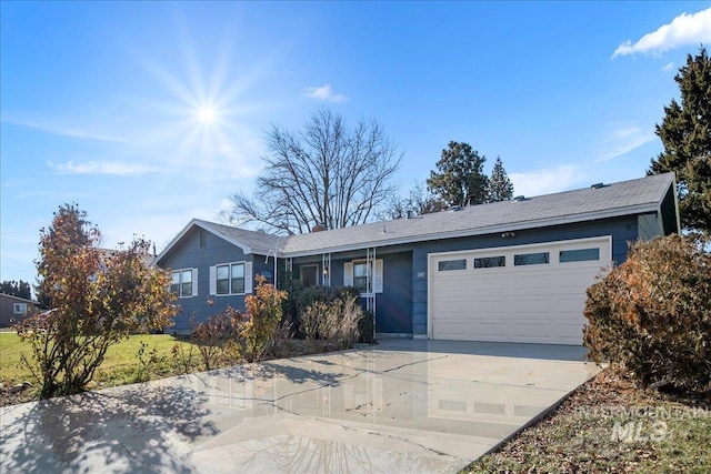 ranch-style home featuring a garage