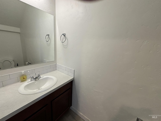 5619 E Bollo St, Nampa, ID 83687 - bathroom with decorative backsplash and vanity