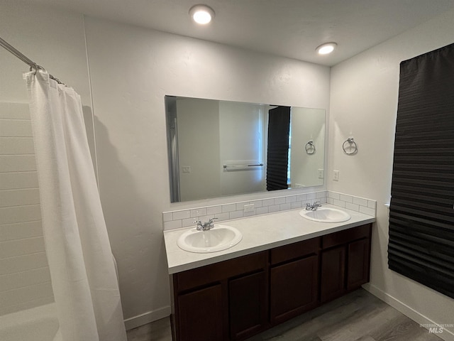 5619 E Bollo St, Nampa, ID 83687 - bathroom with double vanity, wood finished floors, and curtained shower