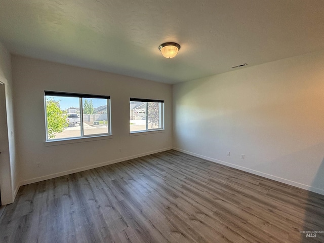 5619 E Bollo St, Nampa, ID 83687 - unfurnished room featuring wood finished floors and baseboards