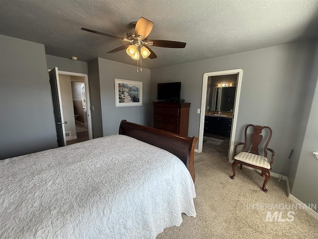 bedroom featuring a textured ceiling, ceiling fan, baseboards, and light colored carpet