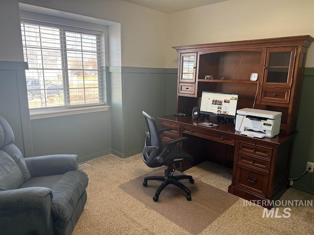 carpeted office featuring wainscoting