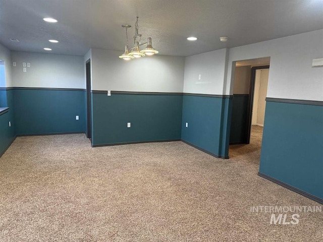 carpeted empty room featuring recessed lighting