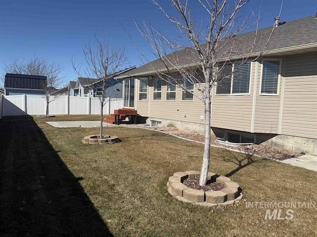 view of yard with cooling unit and fence