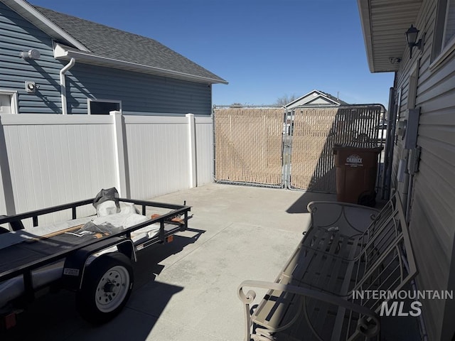 view of patio / terrace featuring fence