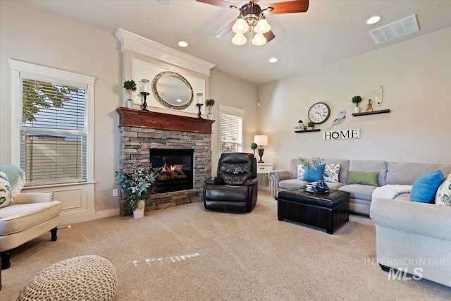 carpeted living area with ceiling fan, recessed lighting, a fireplace, and baseboards