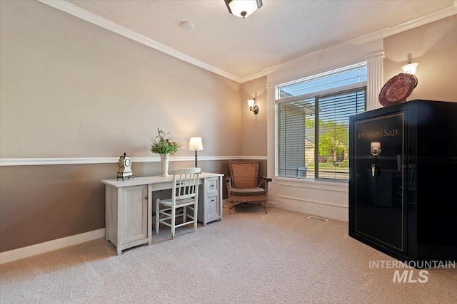 office space with crown molding, carpet flooring, and baseboards