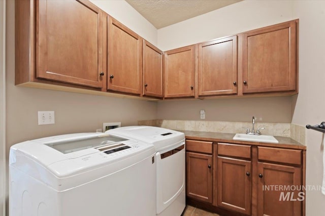laundry area featuring cabinet space and independent washer and dryer