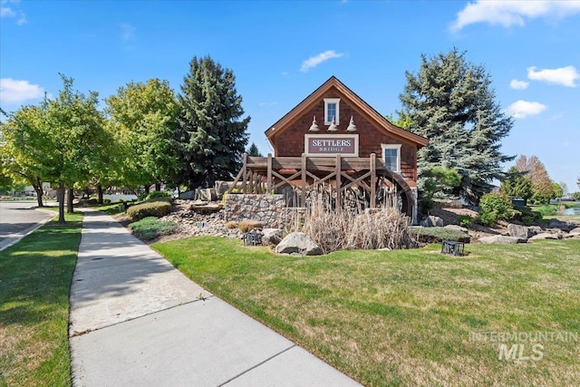 view of property exterior with a lawn