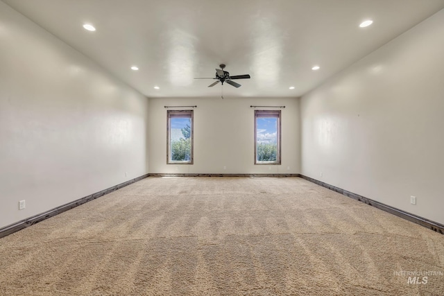 carpeted spare room with ceiling fan, recessed lighting, and baseboards