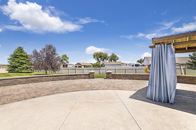 view of patio / terrace featuring a residential view and a fenced backyard