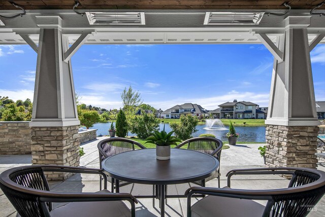 view of patio / terrace with a water view