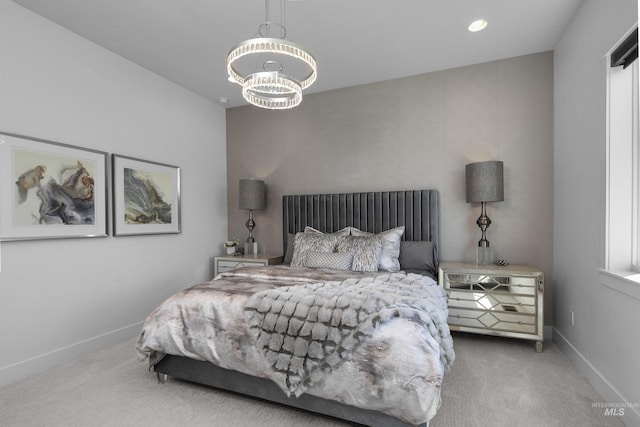 bedroom featuring carpet and a notable chandelier