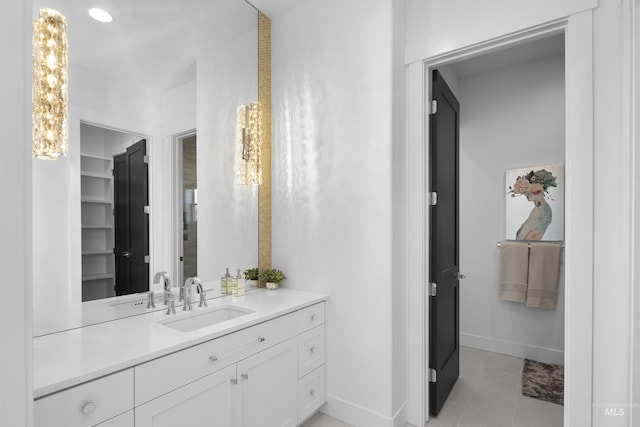 bathroom featuring tile patterned flooring and vanity