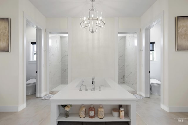 bathroom with a chandelier and toilet