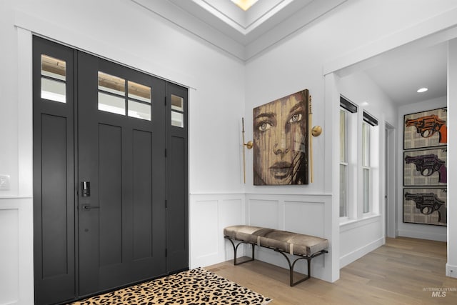 foyer entrance with light hardwood / wood-style floors