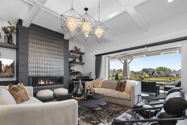 living room featuring beam ceiling, a fireplace, and a chandelier