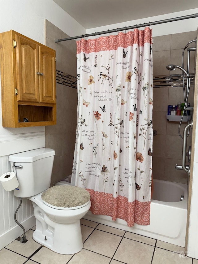 bathroom featuring tile patterned flooring, shower / bath combination with curtain, and toilet