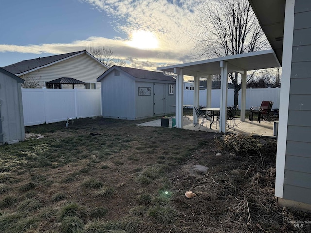 view of yard with a patio area and a shed