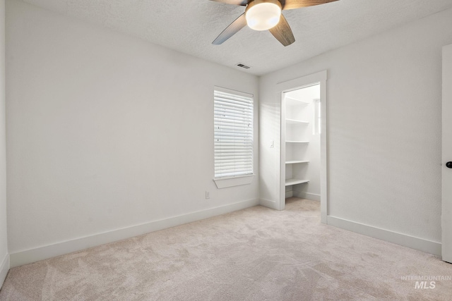 2174 S Myers Pl, Boise, ID 83706 - unfurnished bedroom featuring carpet, baseboards, a ceiling fan, and a textured ceiling