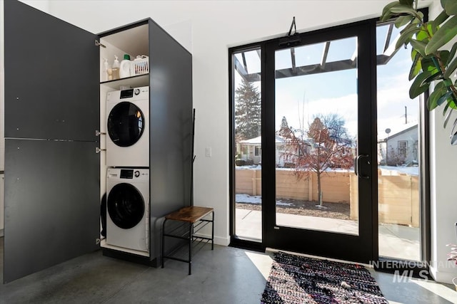 washroom with stacked washer and clothes dryer