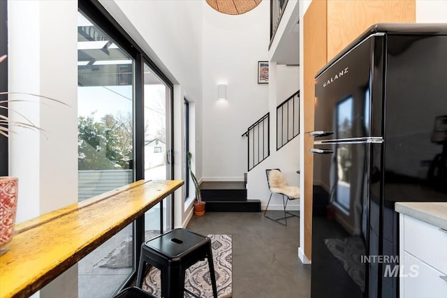 interior space with a towering ceiling