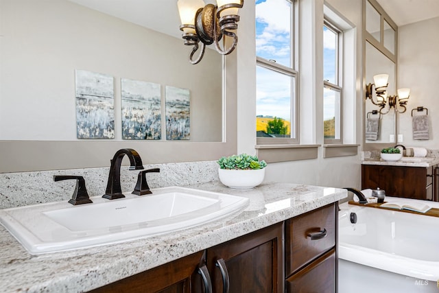 bathroom featuring a tub and vanity