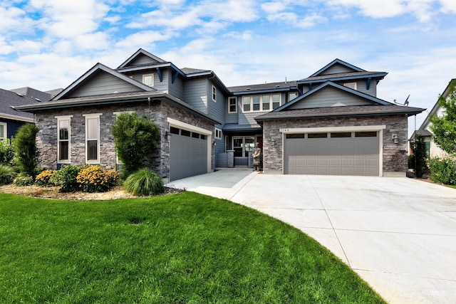 craftsman inspired home with a garage and a front yard