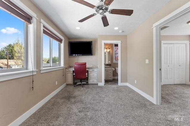 office space with recessed lighting, a ceiling fan, baseboards, and light carpet