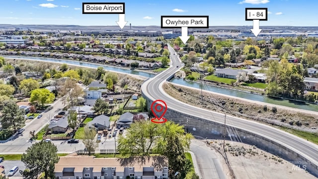 bird's eye view with a residential view and a water view
