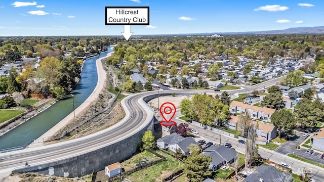 birds eye view of property with a water view and a residential view
