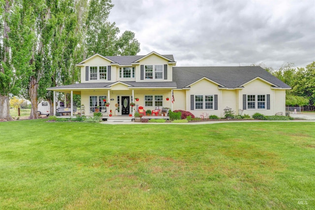 view of front of property featuring a front lawn and a porch