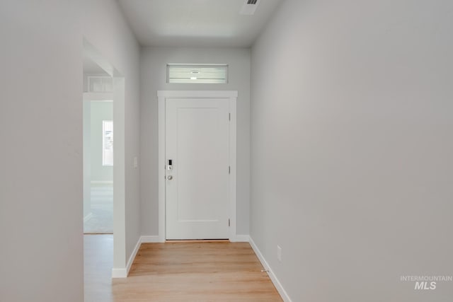 doorway to outside with light hardwood / wood-style floors