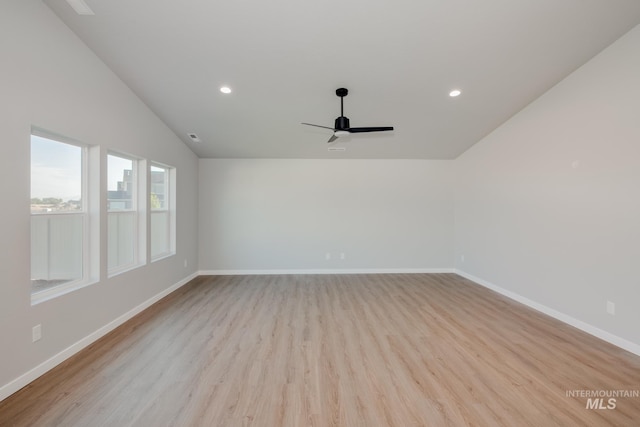 unfurnished room featuring lofted ceiling, light hardwood / wood-style flooring, and ceiling fan