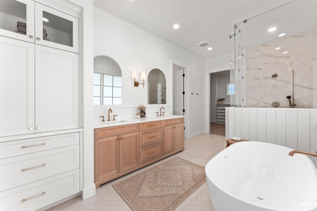 1734 S S Riparian Way, Eagle, ID 83616 - bathroom with double vanity, a freestanding bath, a marble finish shower, and recessed lighting