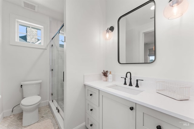 1734 S S Riparian Way, Eagle, ID 83616 - bathroom featuring vanity, toilet, a shower stall, and baseboards