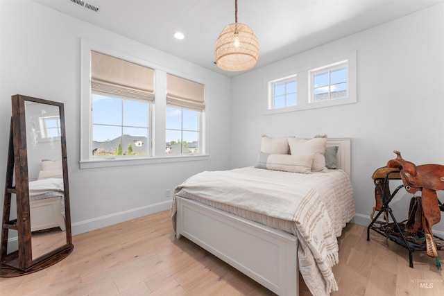 1734 S S Riparian Way, Eagle, ID 83616 - bedroom featuring baseboards, light wood-type flooring, and recessed lighting