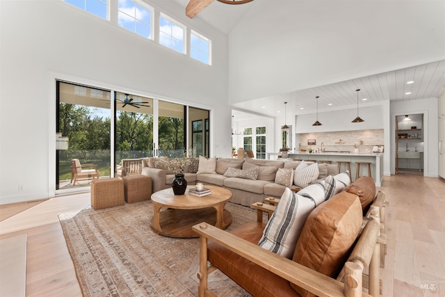 1734 S S Riparian Way, Eagle, ID 83616 - living area with ceiling fan, light wood-style floors, a high ceiling, and recessed lighting