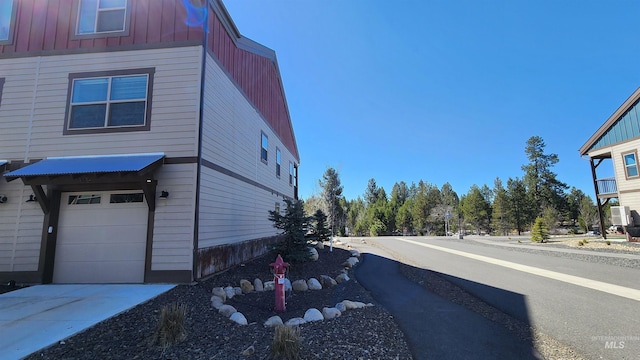 view of side of property with a garage