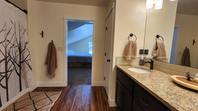 bathroom featuring hardwood / wood-style floors and vanity